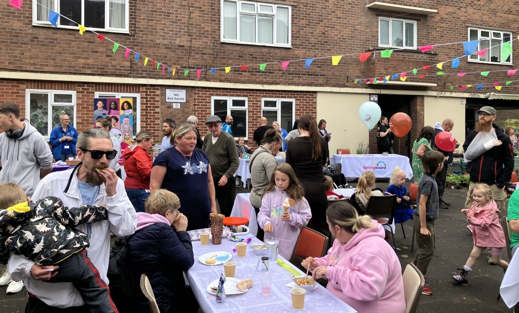 People enjoying food at the party.
