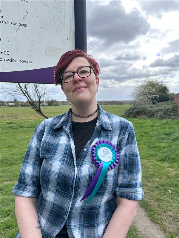 Photo of Ellie Harrison, Equality Party candidate for Croydon, wearing a rosette