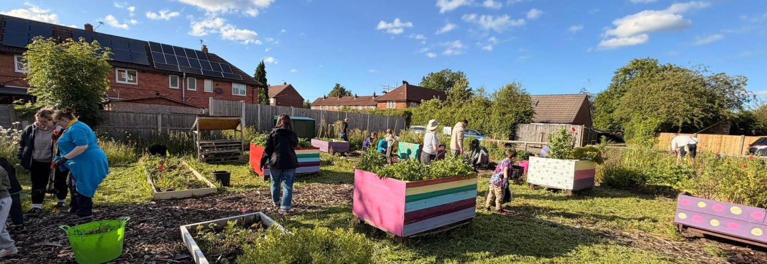 a garden with people working in it